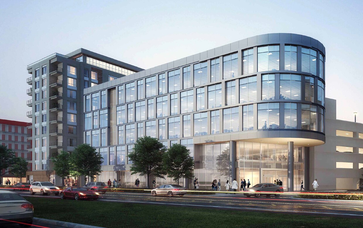 Last Parcel building image with glass windows and lights inside